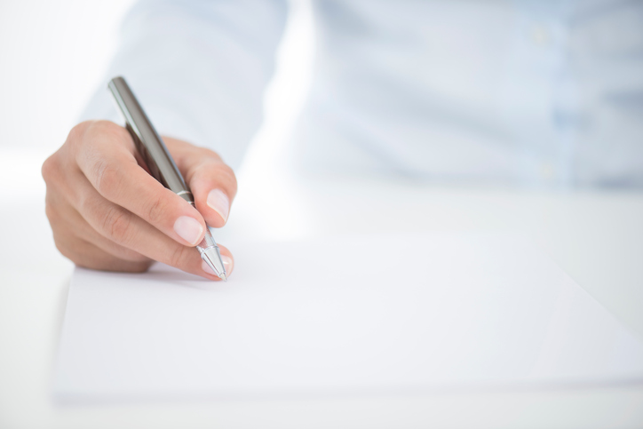 Woman Signing Contract Paper